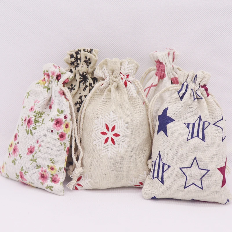 

2019 new 50 pcs best selling fashion cotton linen fabric dust candy/gift/party/school bag home Sundry kids toy storage bags