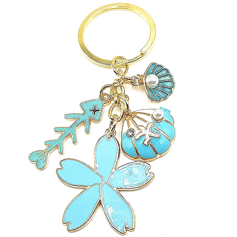 

2020 New Handmade Marine Life Blue Starfish Fish Bone Pearl Shell Gold Keychain Fashion Charm Beach Girl Pendant Keychain