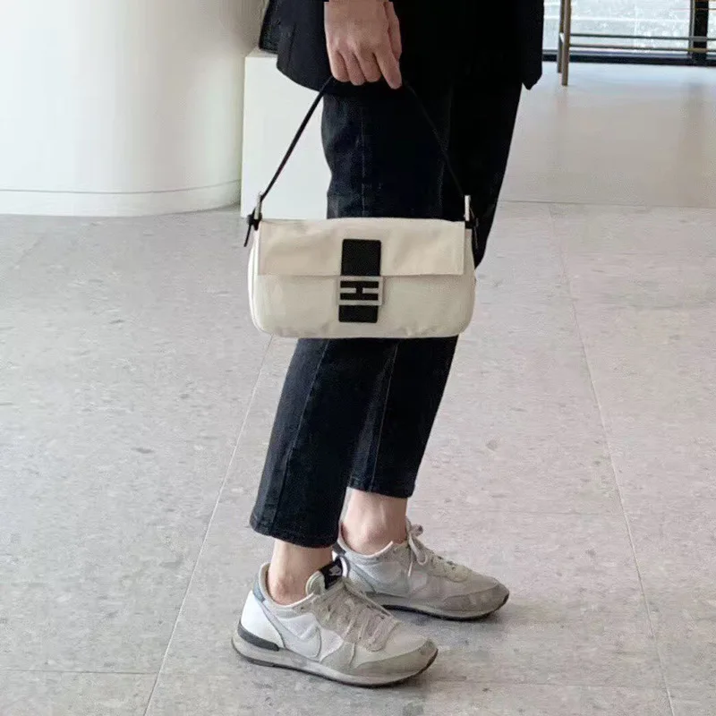 

Bag Women's 2019 Canvas Versatile Buttons Hand Shoulder Bag INS Online Celebrity Non-mainstream Armpit Shoulder Baguette Bag