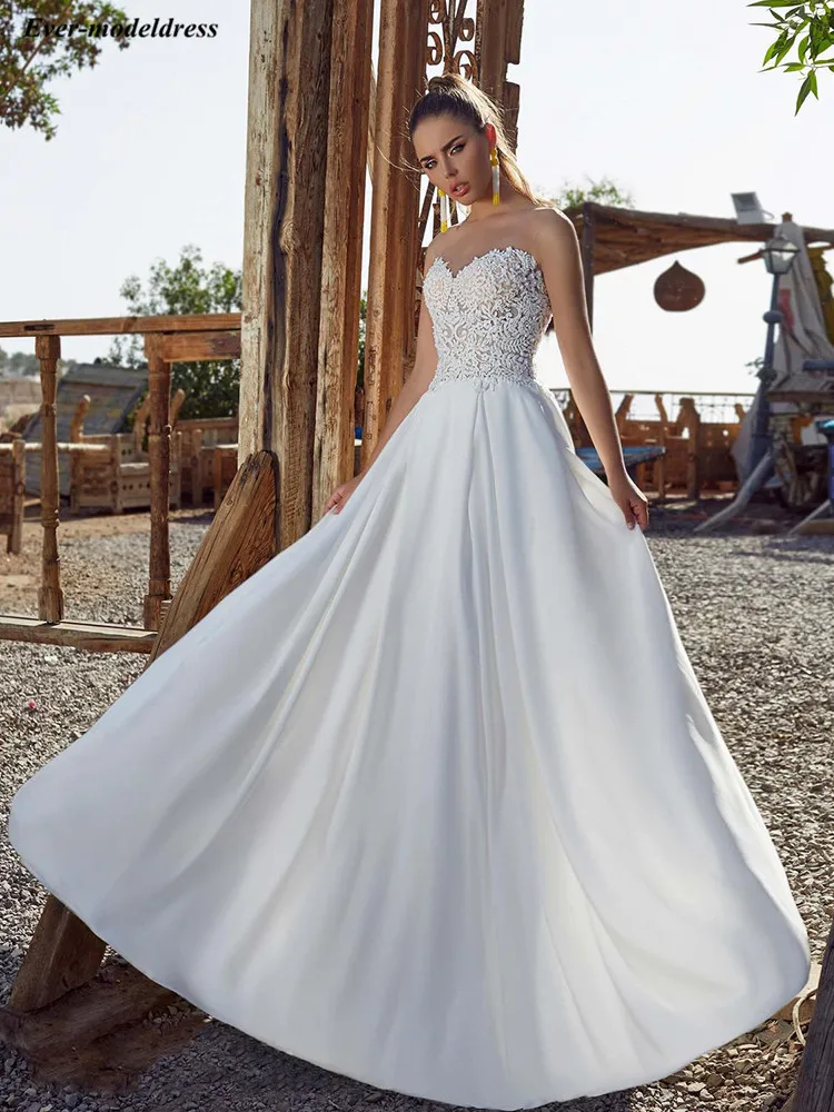 

Boho Beach Wedding Dress 2020 Sheer Neck Button Back Appliques Top A line Floor Length Wedding Gowns For Bride vestidos de novia