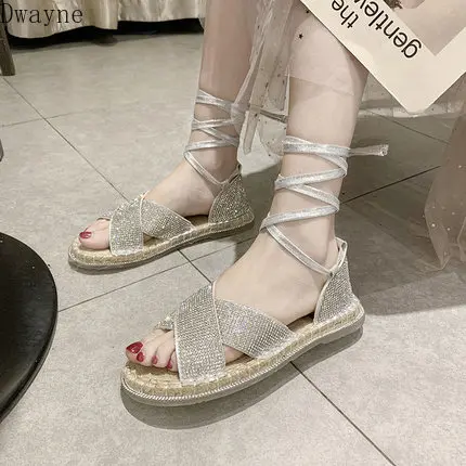 

Korean version of rhinestone cross belt open toe flat bottom fashion soft bottom wild sandals tide