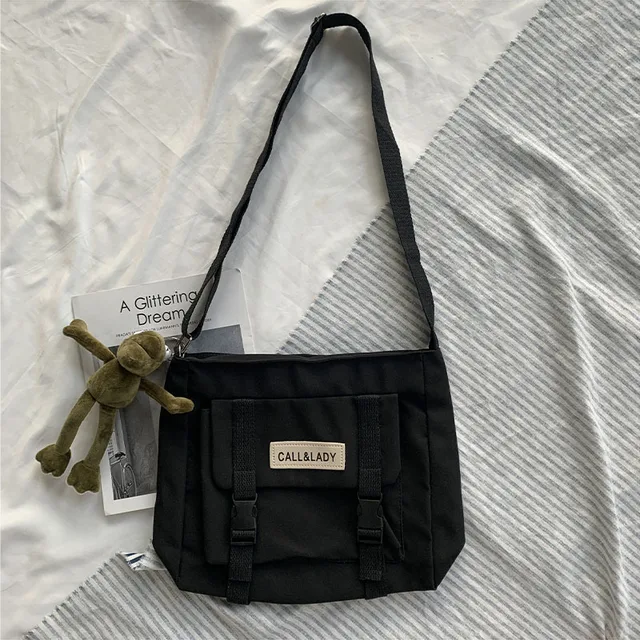 Fashion Classic Simple Messenger Bag Women's South Korea Chic Postman Bag Lady Student Nylon Waterproof Canvas Schoolbag Frog pendant