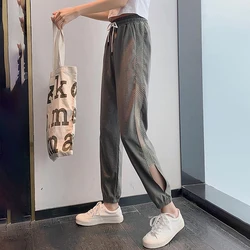 Pantalones de chándal informales de seda helada para mujer, calzas holgadas huecas de talla grande, moda coreana, pantalones de cintura elástica que combinan con todo