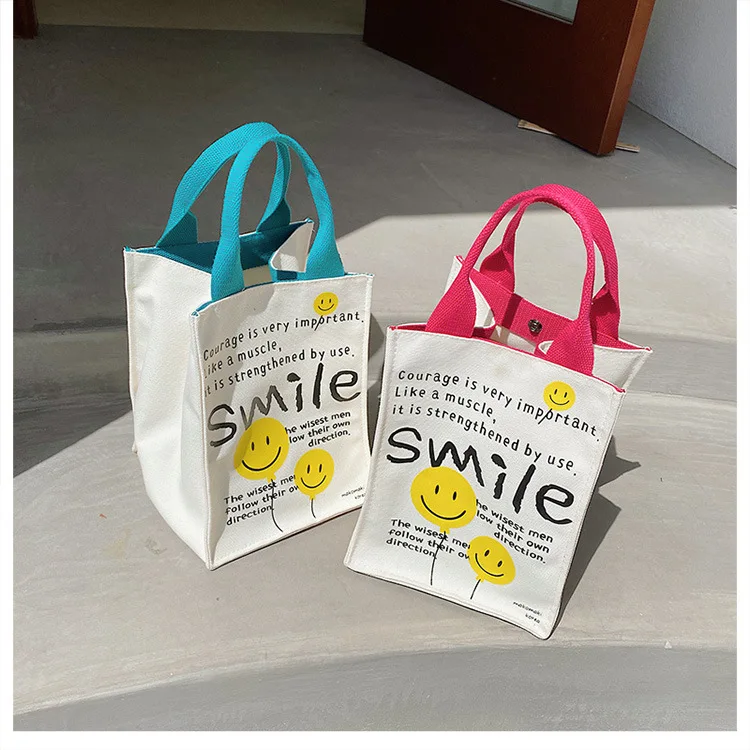 2022 Canvas bag New Summer Korean Japanese Cartoon Canvas Smile Handbag Large Capacity Shoulder Bag Hit Color Letter Female Tote