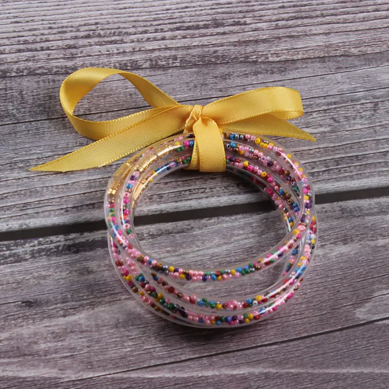 

Yellow Bow Rainbow Bean Jelly Bangles Set All Weather Stack Silicone Plastic Glitter Bangles Gifts For Women 5pcs/set
