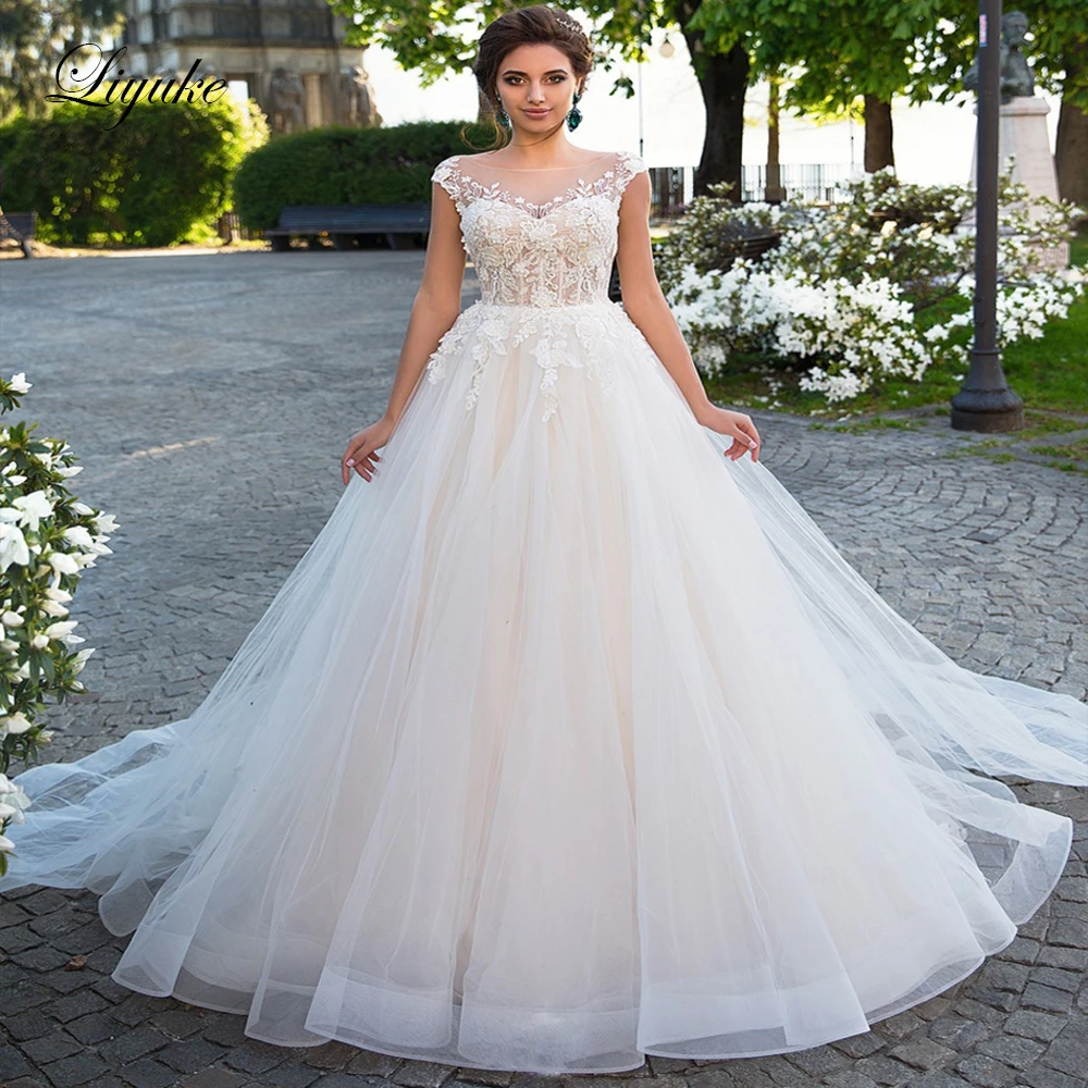 

Liyuke Princess A Line Wedding Dress Cap Sleeve Of Button Closure Puffy Bridal Dress
