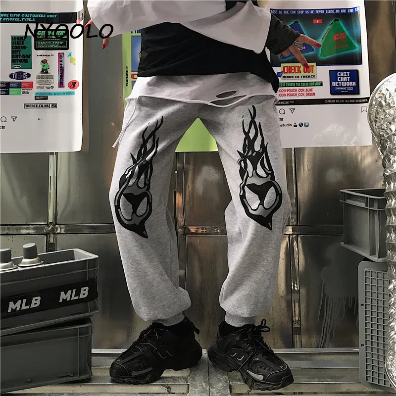 NYOOLO Harajuku уличная одежда с принтом пламени плюс бархатные теплые штаны для бега осень зима эластичный пояс хип-хоп шаровары для женщин и мужчин