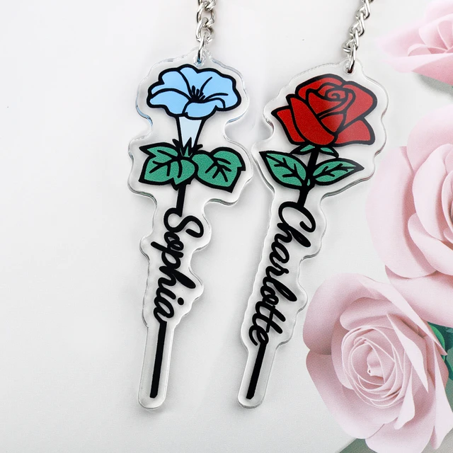 Porte-clés créatif flacon avec fleur rose sèche sur