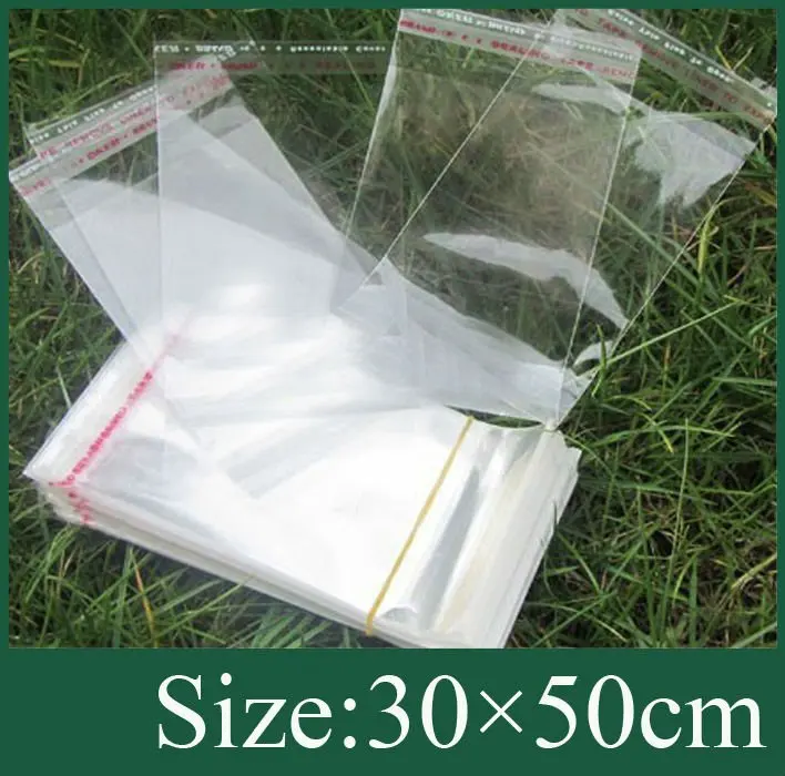 

Poly Bag with white header in size 30x50cm with self adhesive seal and with hanging header & Free Shipping 100pcs/lot