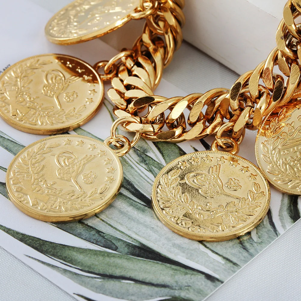 Lot - 18-Karat Yellow-Gold and Gold Coin Charm Bracelet