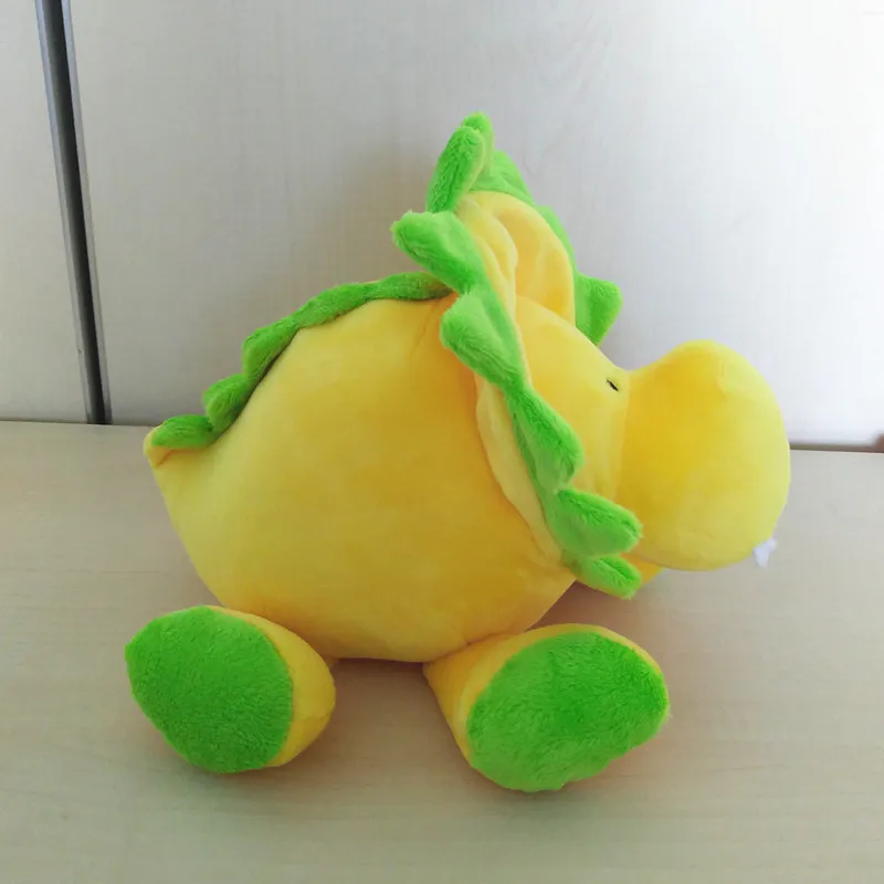 yellow stuffed dinosaur