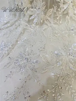 

Luxury embroidered net lace fabric Fancy flower beaded tulle fabric for bridal dress