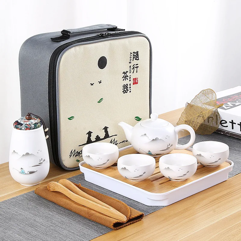 Tetera de cerámica una maceta cuatro taza de viaje al aire libre de tetera de kungfú bolsa de viaje taza de Tcup regalo juego de té chino diseñador