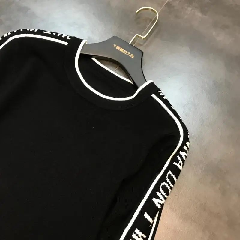 autumn new shoulder sleeves side letters black and white contrast color round neck long-sleeved knit sweater women