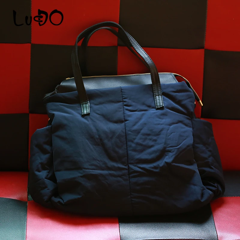Goede 2019 Nieuwe Winter Vrouwen Handtassen Dames Warm Tote Tas Mode Ruimte Katoen Materiaal Grote Pakket Down Jas Zak Sac EEN belangrijkste Bolsa