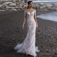 

Charming Mermaid Wedding Dress 2021 Sheer Neck Long Sleeve Button Lace Appliques Sweep Train Bride Gown Vestidos De Noiva