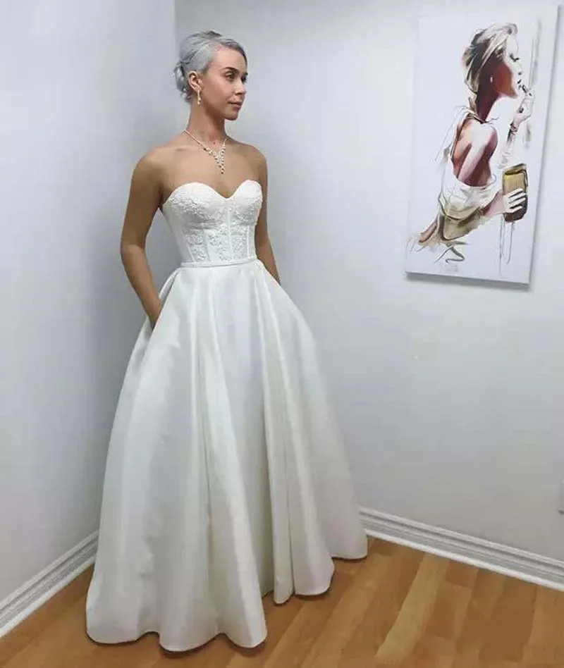 

Elegant Satin A Line Wedding Dresses Sweetheart Appliques Bridal Gowns With Pocket Garden Simple Sweep Train Wedding Gowns