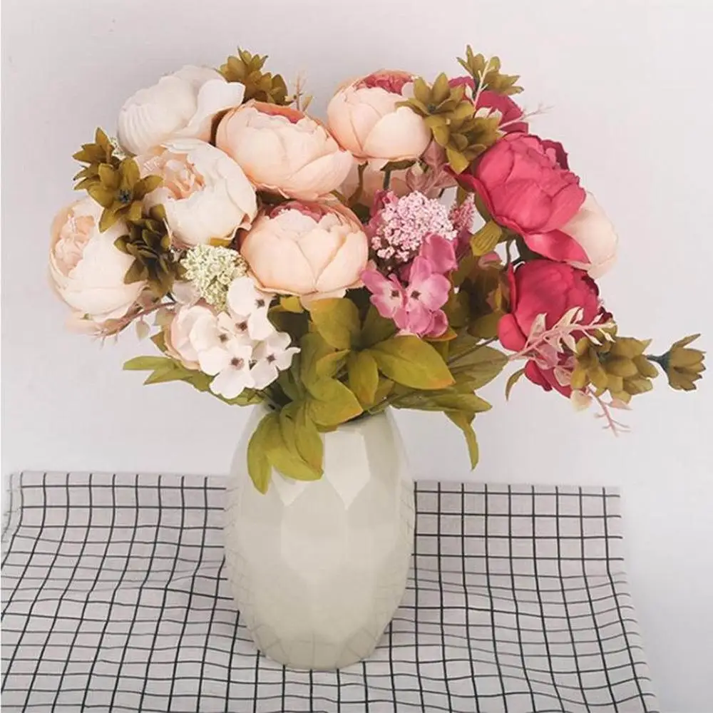 Dining room table decorated false flowers core peony peony flower shape