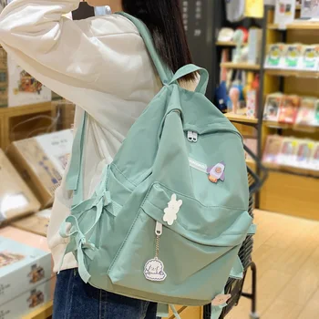 

DCIMOR New Waterproof nylon Women Backpack Female bowknot Solid color schoolbags for students Travel bag Daily backpack Mochilas