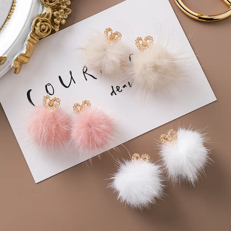 

in winter, summer, fall, furry ball earrings han edition of the new plush ball ball stud earrings hollow out love