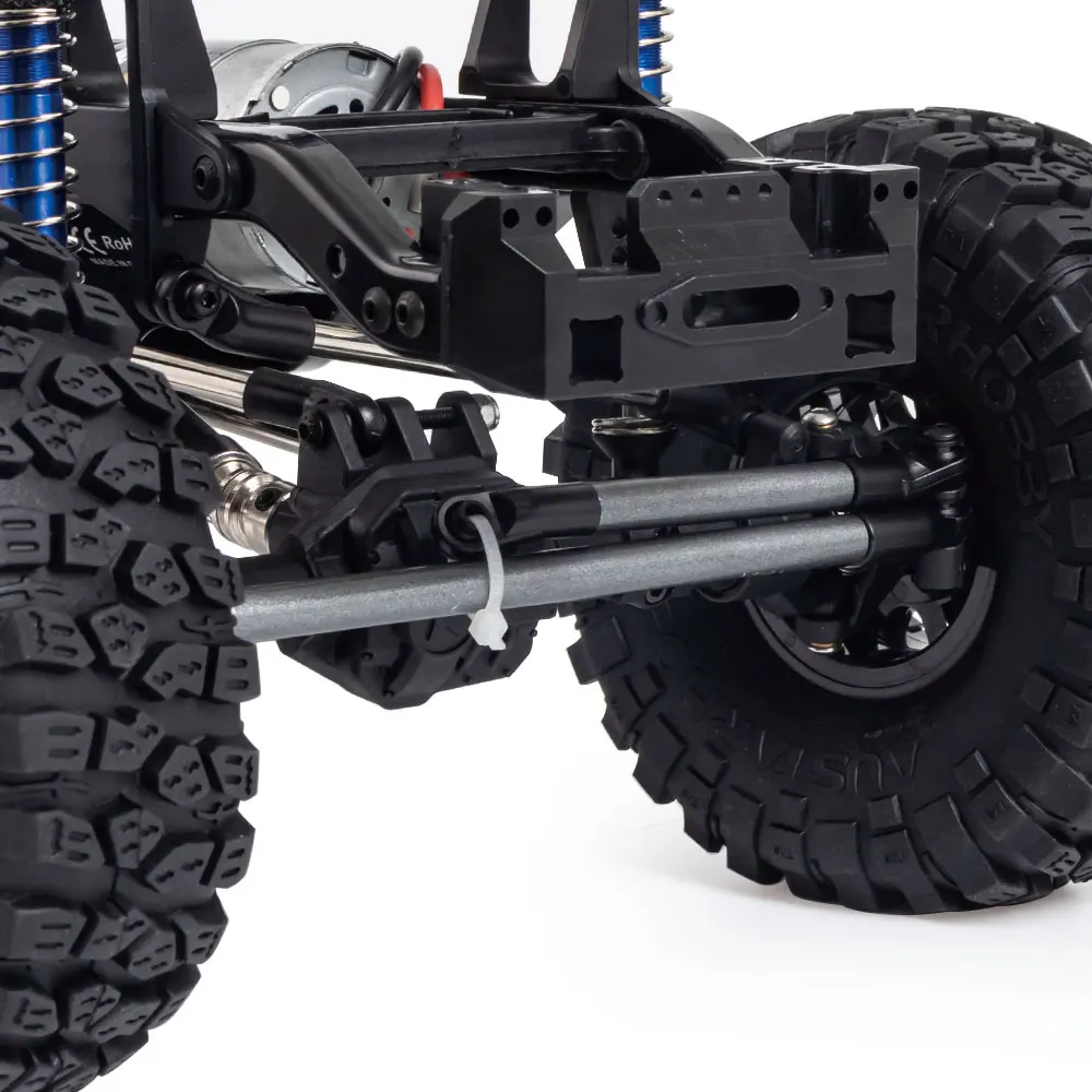 Détail de l'essieu nylon du châssis crawler RC 1/10 DIY, avec le moteur 35T 550 visible en arrière-plan.