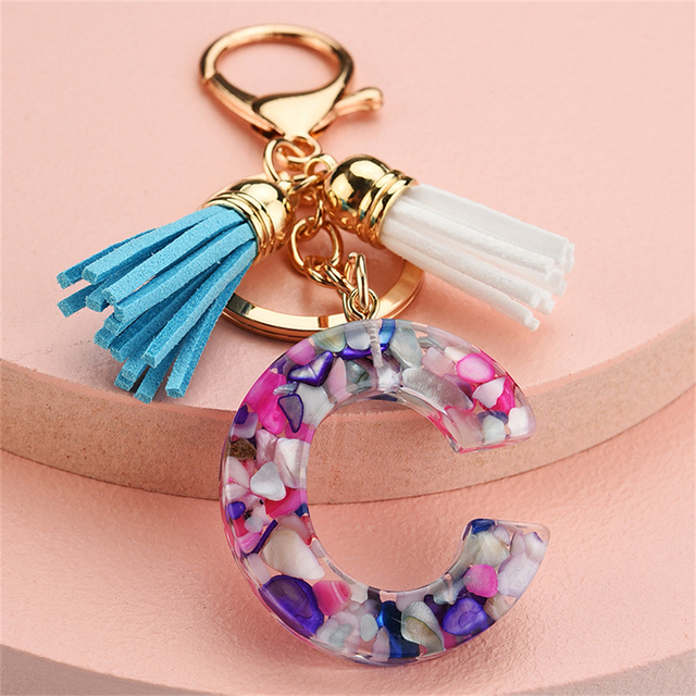 Women Keychains 26 Glitter Hollowed-out Words Handbag Tassel English Letter Keyring with Puffer Ball Charms Free Shipping