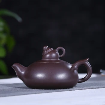

Authentic yixing recommended manual undressed ore purple clay pot pot capacity of 150 ml