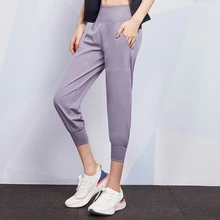 Беговые Капри женские свободные эластичные штаны для йоги Талия Фитнес Беговые тренировочные штаны с карманами женские Слаксы
