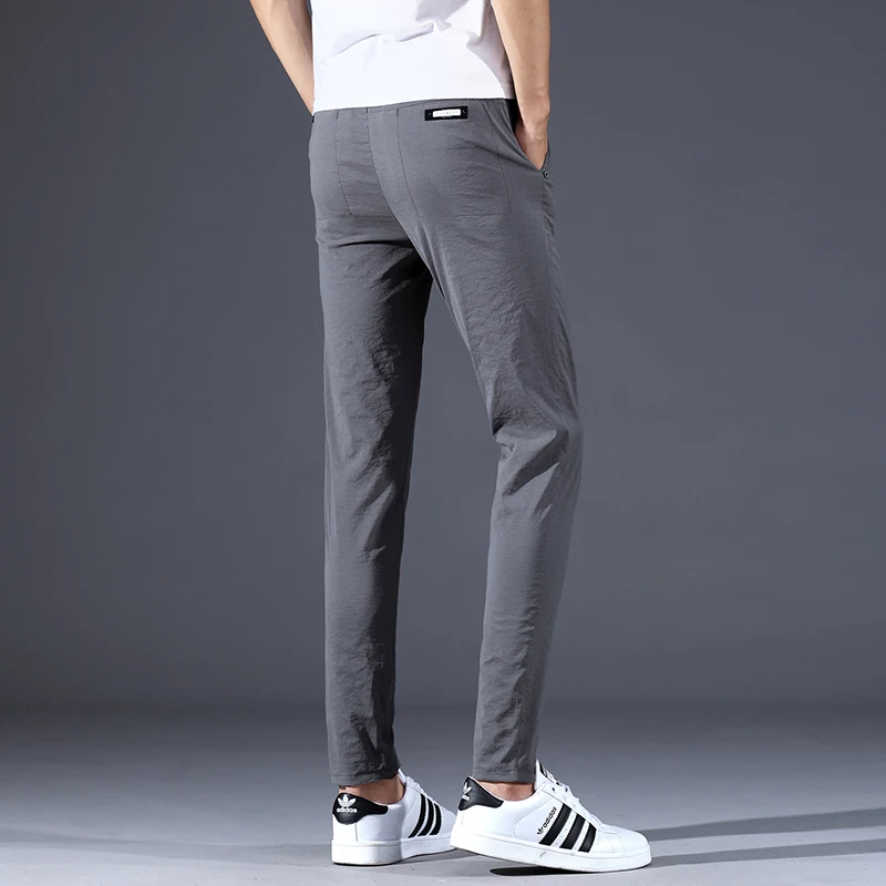 Для мужчин s стрейч мода Slim Fit Повседневное Штаны с эластичной резинкой на талии штаны черного и серого цвета Для мужчин джоггеры Штаны одноцветные слипоны; ботильоны на Длина впитывает пот и Штаны