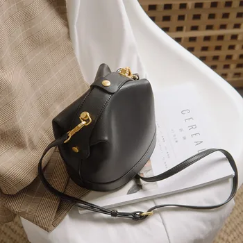 

Niche leather bucket bag slanting female fashion rivets luxury handbags women bags designer bags for women 2020