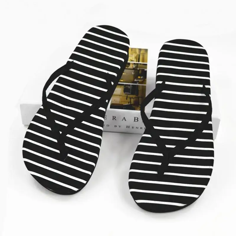 black and white striped flip flops