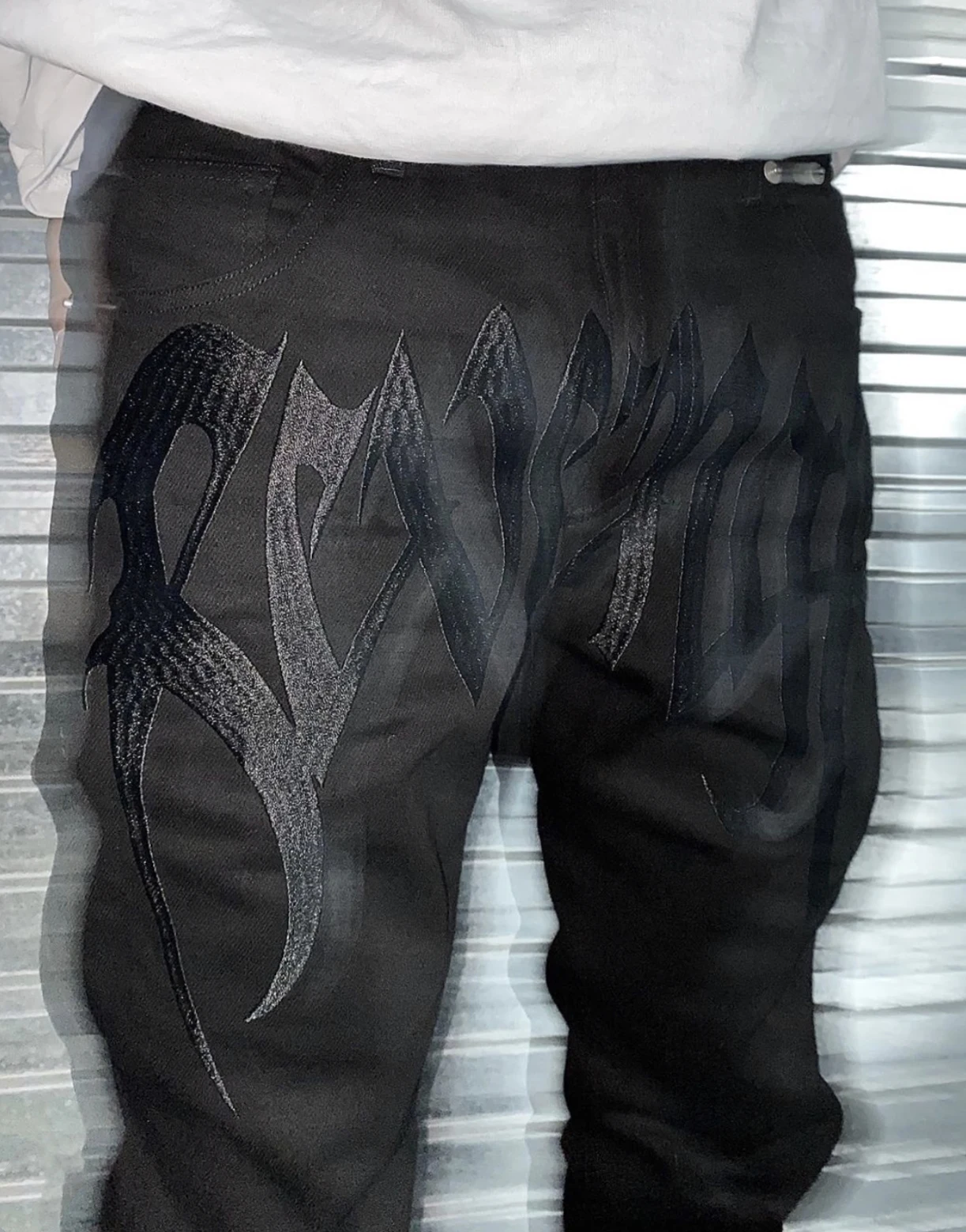 The same REVENGE embroidered jeans 