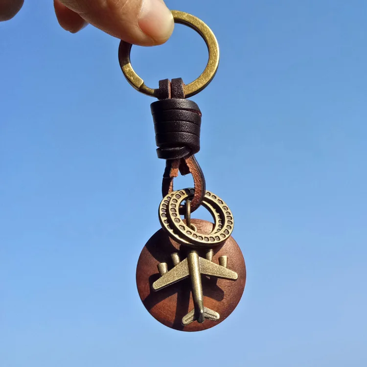 Porte-clés Vintage en cuir fait à la main, pendentif rond en bois Bronze avion, nouveau porte-clés de voiture