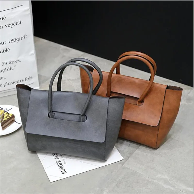

Hot sale 2019 Women Bags Female Shopping Bag European PU OL handbags solid totes big size trapeze style women top handle bags