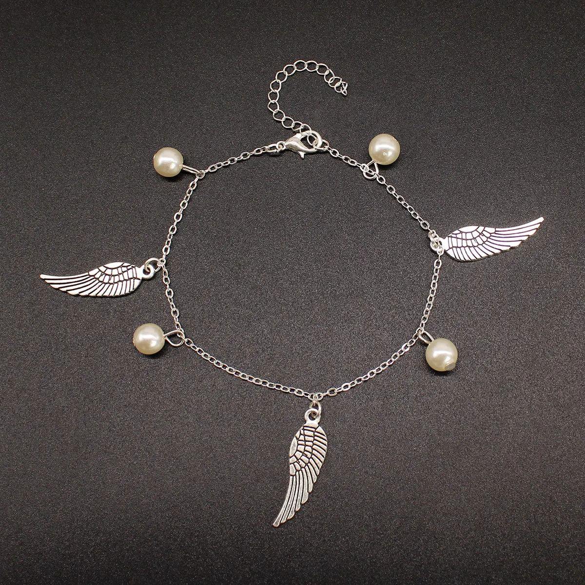 

Europe And America jiao shi pin Bohemian Fashion Pearl Anklet Women's Cool Alloy Wing Ankle Ring K203