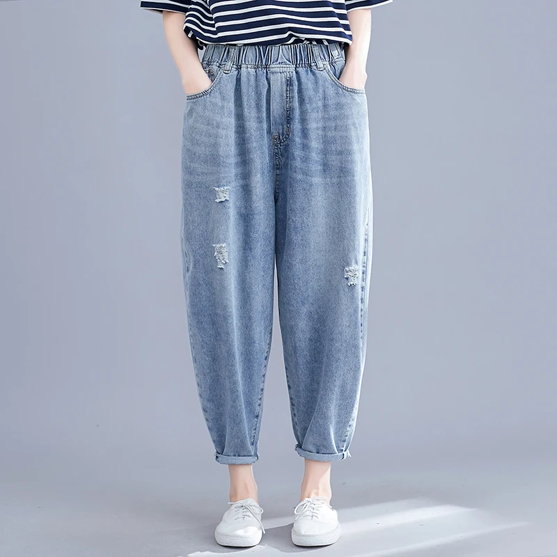 Real shot spring new women's wash water denim pocket solid color hole elastic nine points harem pants wild