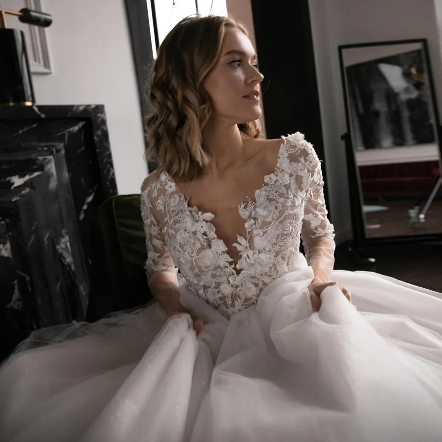 

3D Floral Applique Wedding Dress Glitter Tulle V-Neck Long Sleeves Open Back Ivory Bridal Dress Pearls Sash Sparkly Princess