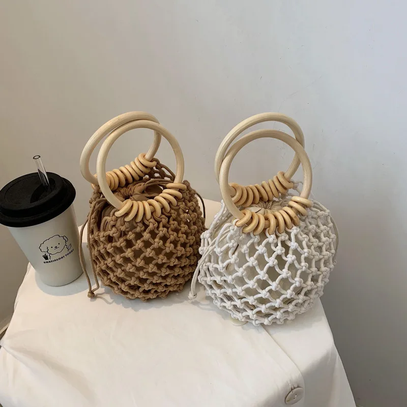 

2020 new high quality handmade drawstring fashion straw bag small fresh one-shoulder woven beach bag lady handbag wooden handle