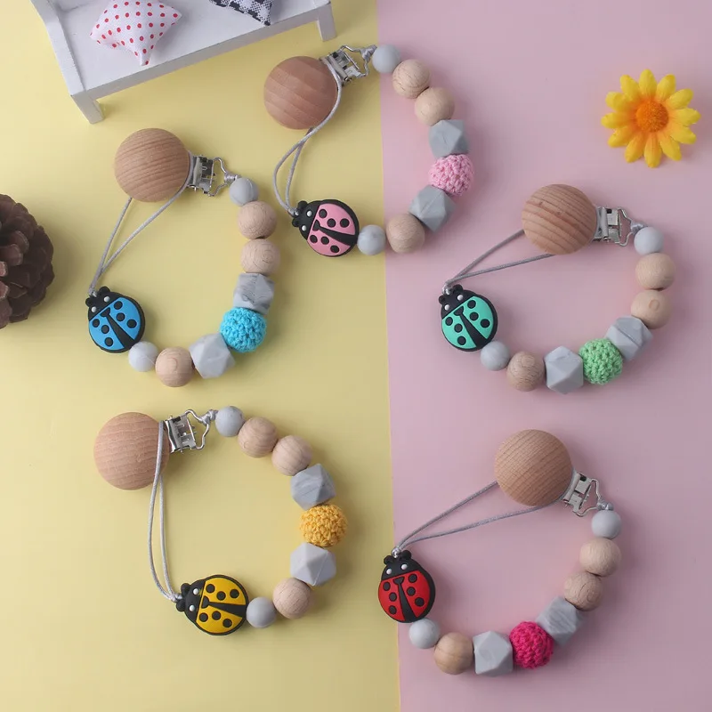 

Cute Ladybug Beads Pacifier Clips Safe Silicone Pacifier Clip Wooden Bead Clip Holder Soother Chains Baby Teething Toy Accesory