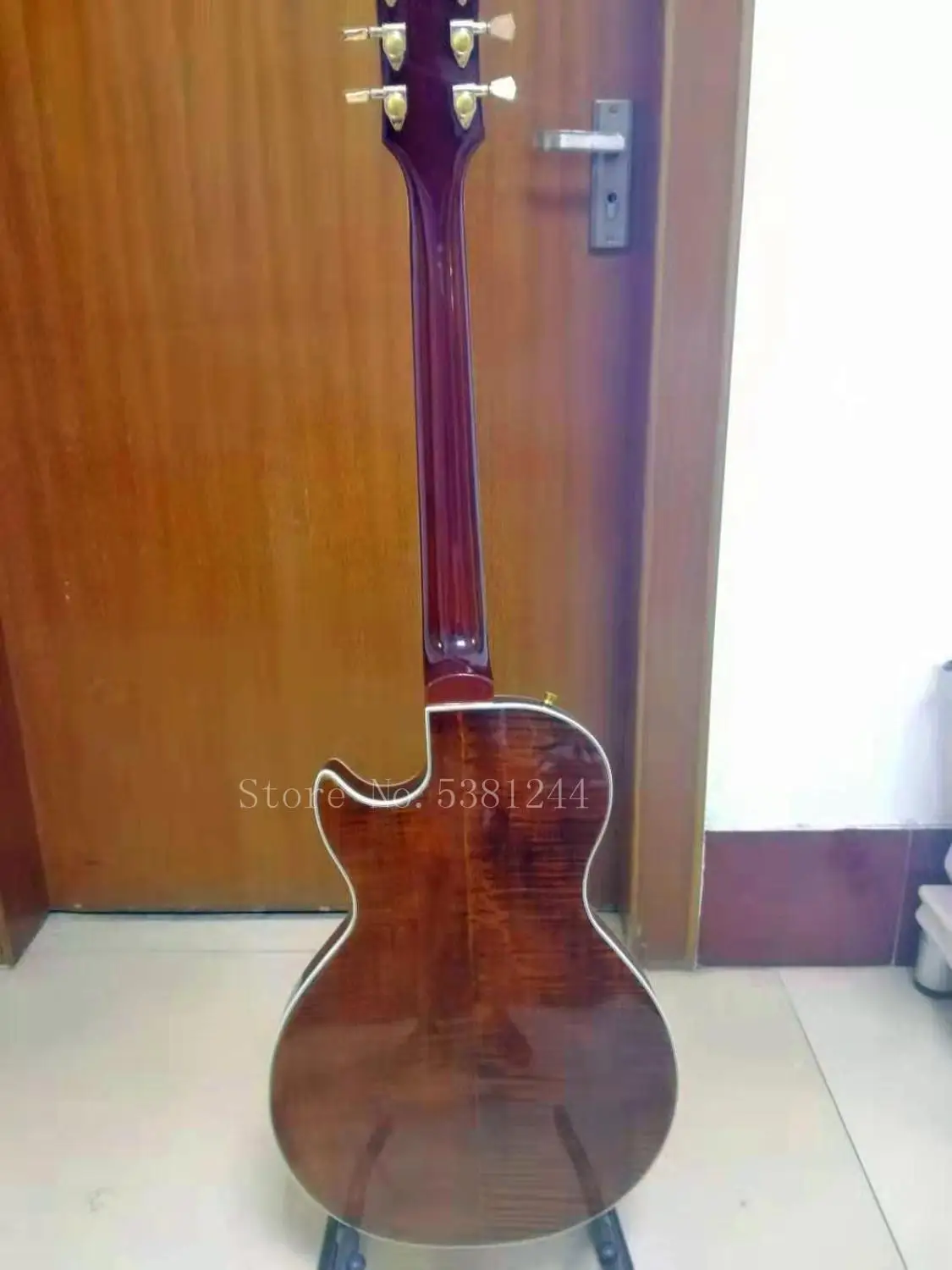 Transporte gratuito, guitarra Electrica personalizada de FABRICA, diapasón de Ebano, agujeros de doble f, rayas de tigre dobles