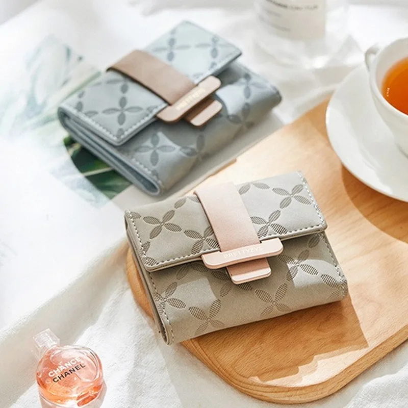 

Korean version of the trend of small fresh wallet women short 2020 new fashion Korean version cute ins student folding change