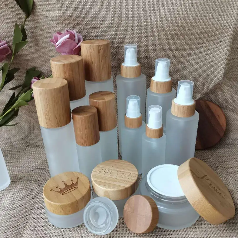 

Environmental bamboo lid glass bottles 30ml 50ml 100ml 120ml 150ml frosted/clear glass bamboo bottles with lotion/spray cap