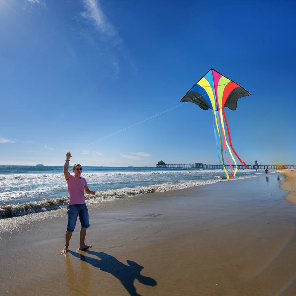 Backyard and Outdoor Ac Parks Including Reel and Bag Wide Colorful Kite Rainbow Vivid Colors for Kids and Adults 60 Inches Wings Single Line Flyer with Long Tail 95 Inches Perfect Flying Toy for Beach Easy to Assemble and Fly in Seconds to Catch Wind