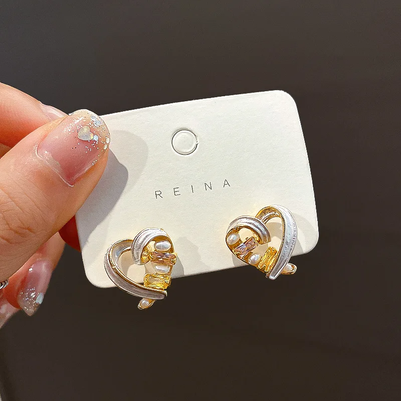 

NPKDS Korean Temperament Simple Sweet Heart-shaped Earrings Pearl Cute Peach Heart Earrings Female Student Jewelry