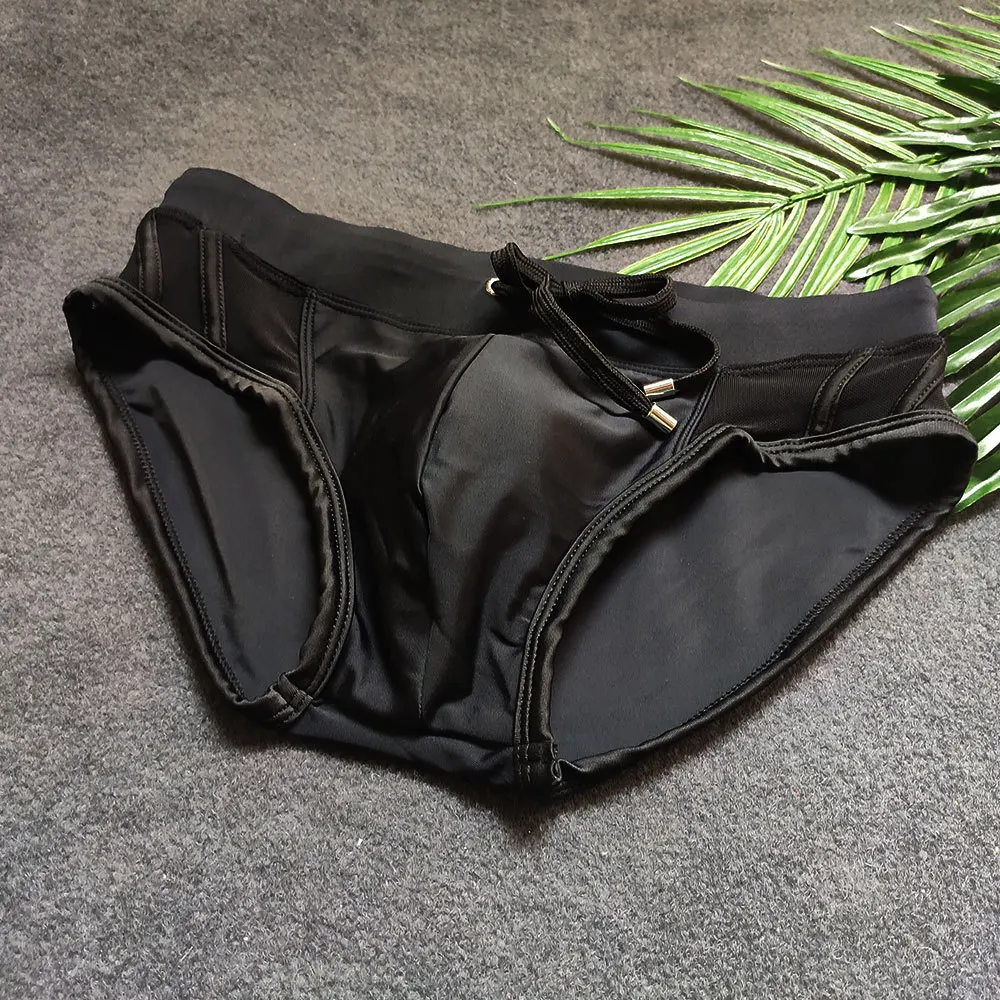 Summer Men's Black Swimwear Sexy Mesh Side Bikini Swimming Pool Briefs With/Without Sponge Pad Low Waist Solid Patchwork Bequine