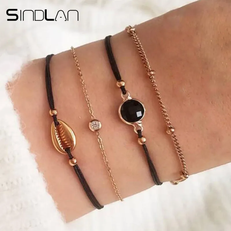 

Sindlan 4PCs Black Natural Stone Gold Shell Bracelets Set Boho Charm Bangles Bracelets for Women Fashion Gothic Wrist Jewelry