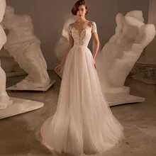 Modest A-LIne Wedding Gowns Short Sleeve V-Neck Tulle Lace Mild Appliques Bridal Dress Coverd Button Court Train Robe De Mariée