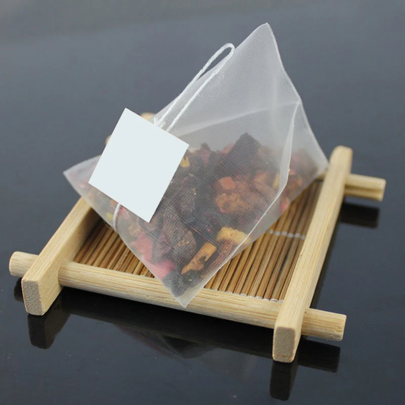 Source Custom Pyramid Food Grade Nylon Empty Mesh Triangle Drawstring Tea  Bag Flower Tea Filter Bag on m.alibaba.com