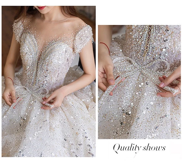 Luxury Ball Gown Wedding Dresses Sexy Backless Short Sleeve Bow Rhinestone Crystal Sequins Chapel Train Long Princes Bridal Gown