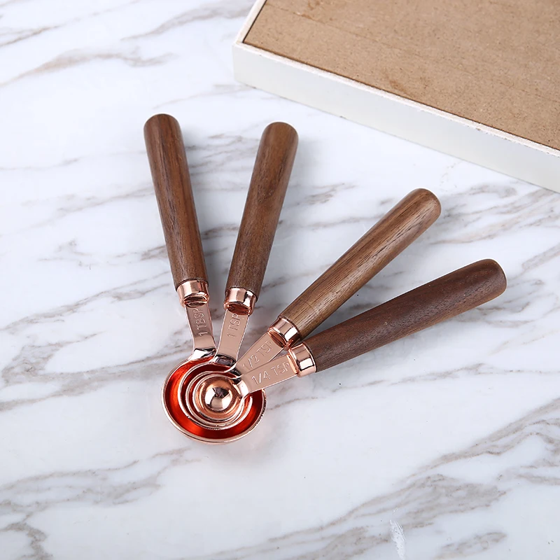 https://ae01.alicdn.com/kf/Hb223638560cd4f8d99ee7e9ca406fa0bE/New-Walnut-Handle-Measuring-Scoops-Stainless-Steel-Plated-Copper-Kitchen-Measuring-Spoon-Cup-For-Baking-Brewing.jpg